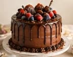 Chocolate Midnight Velvet cake with a glossy ganache drip and berries